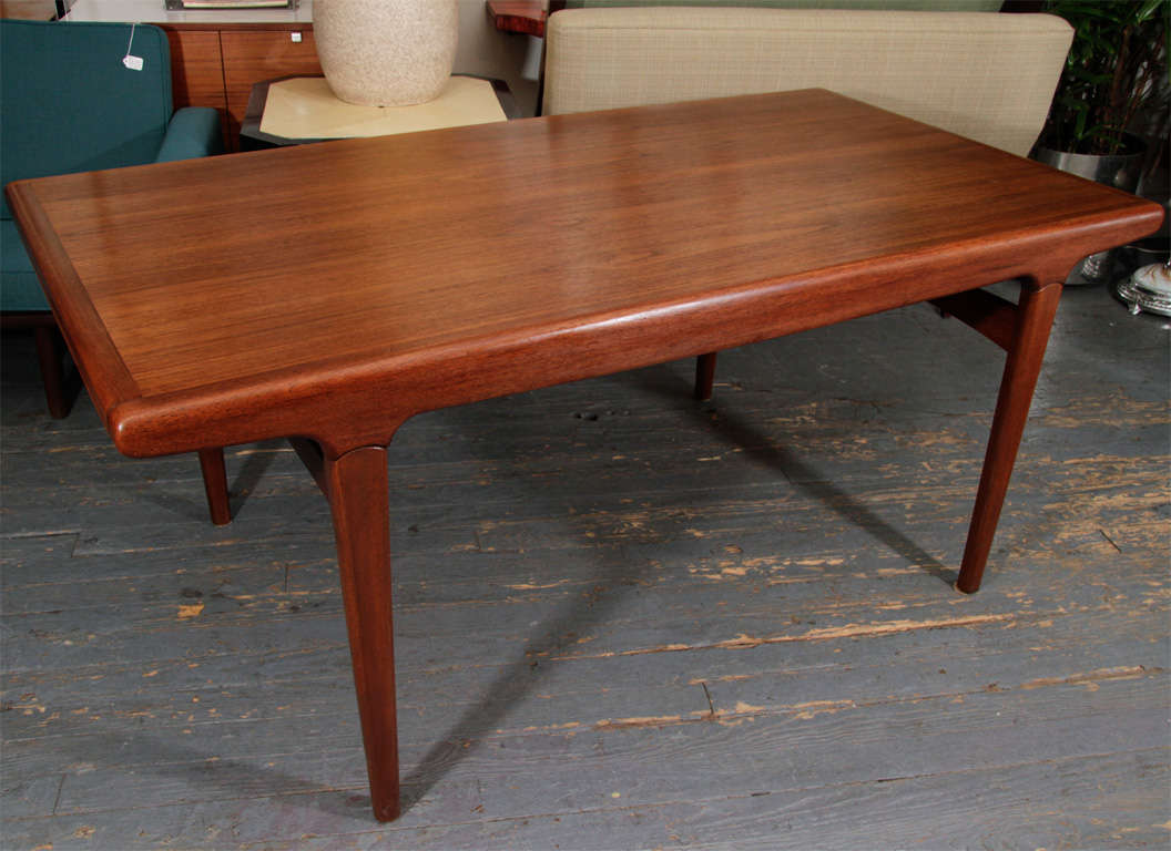Handsome and sculptured, Danish teak dining table with 2 extensions of 26.75
